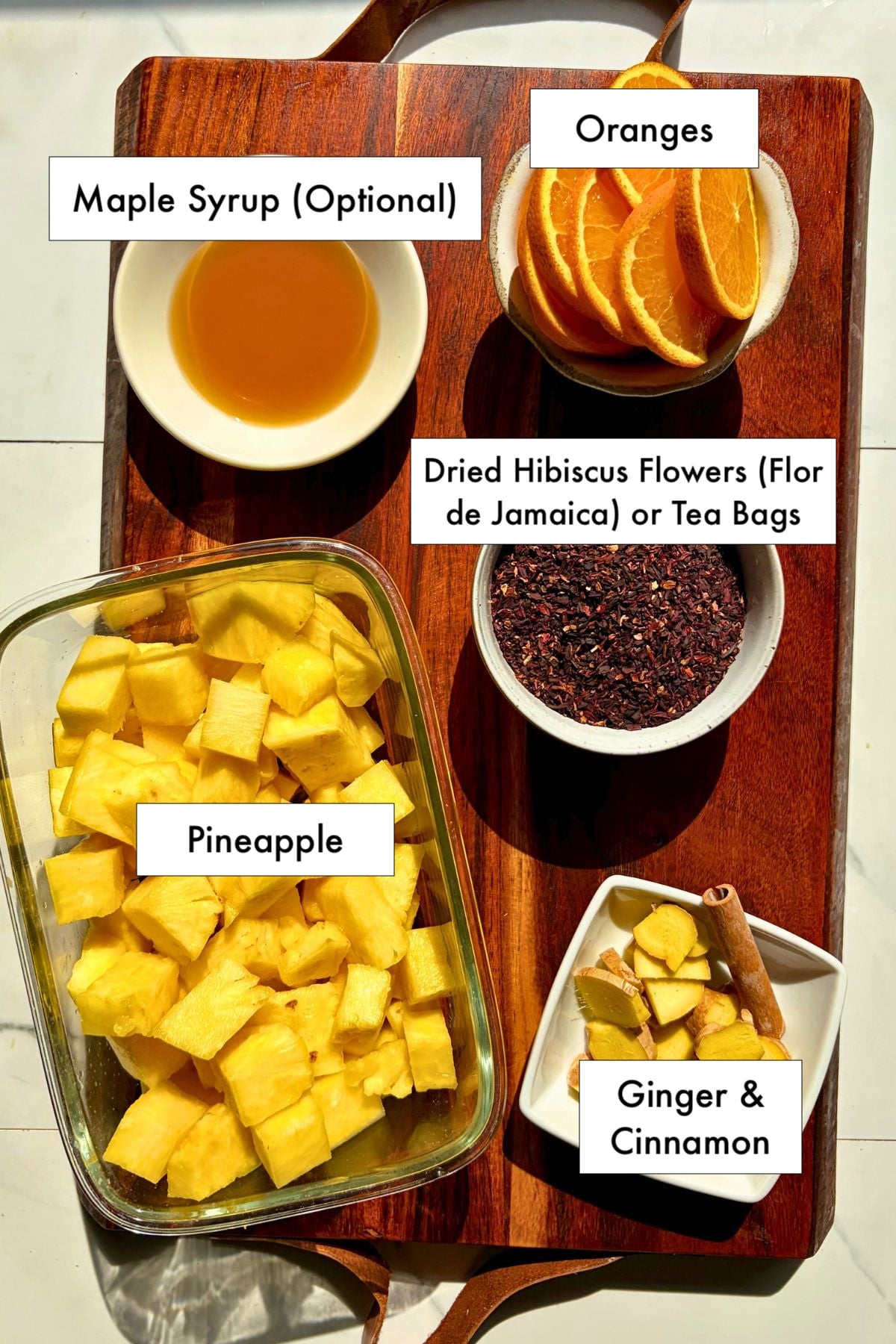 Ingredients for pineapple hibiscus sun tea on a counter.