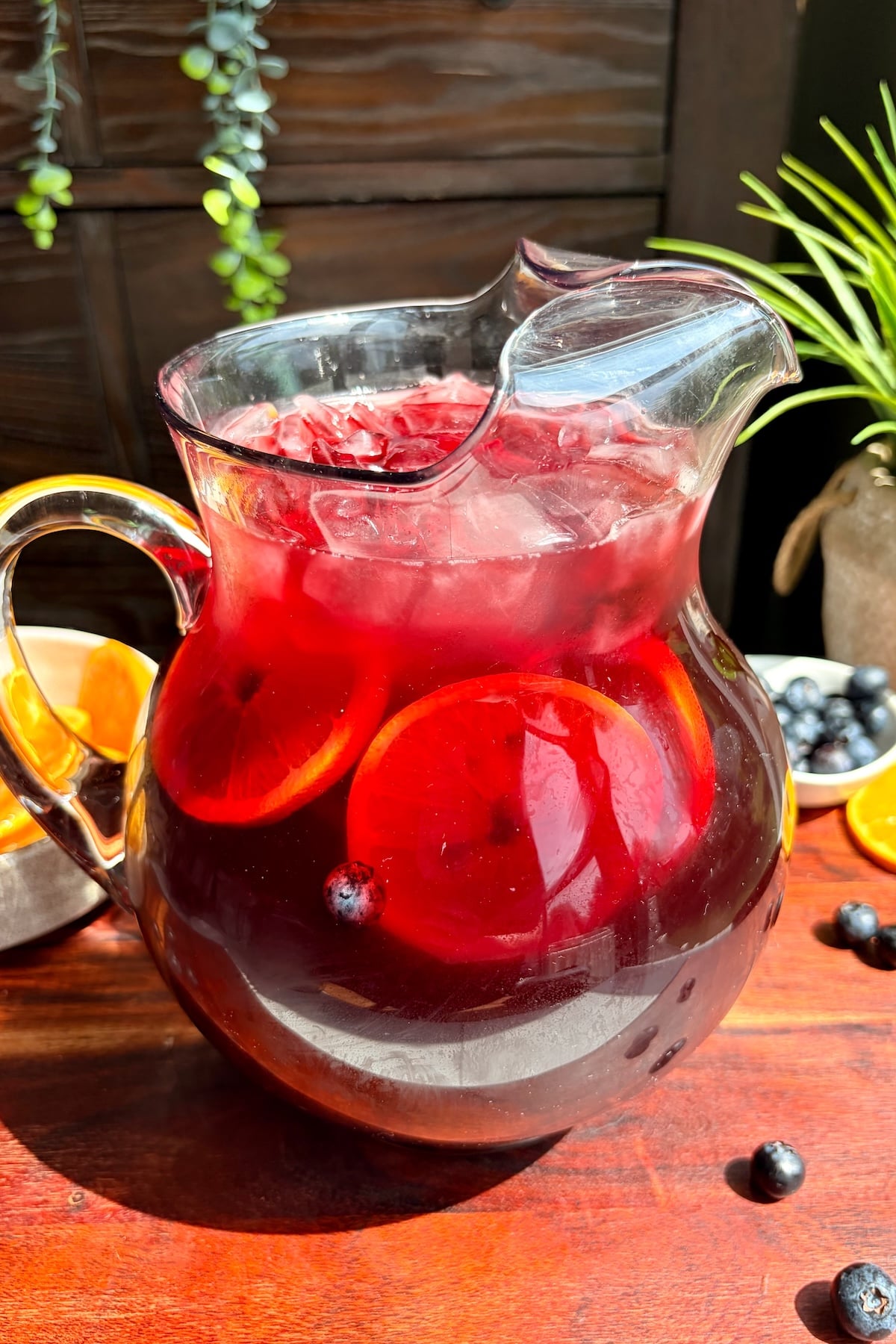 Pineapple hibiscus sun tea in a pitcher.