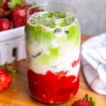 Strawberry matcha latte in a glass.