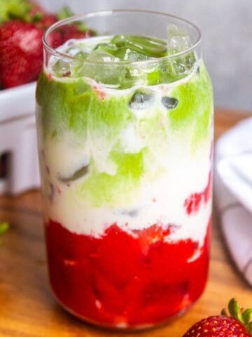 Strawberry matcha latte in a glass.