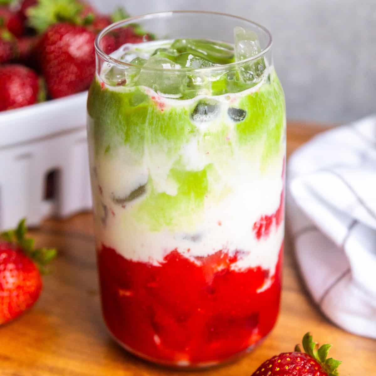 Strawberry matcha latte in a glass.