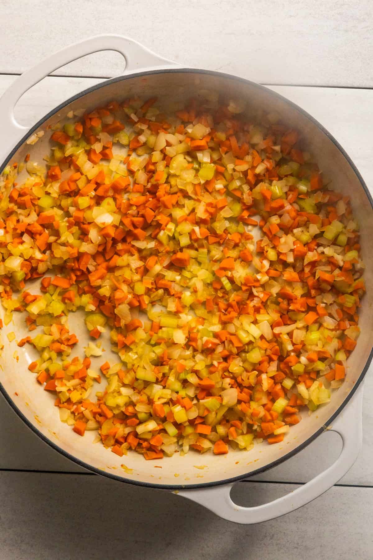 Mirepoix sautéing in pot.