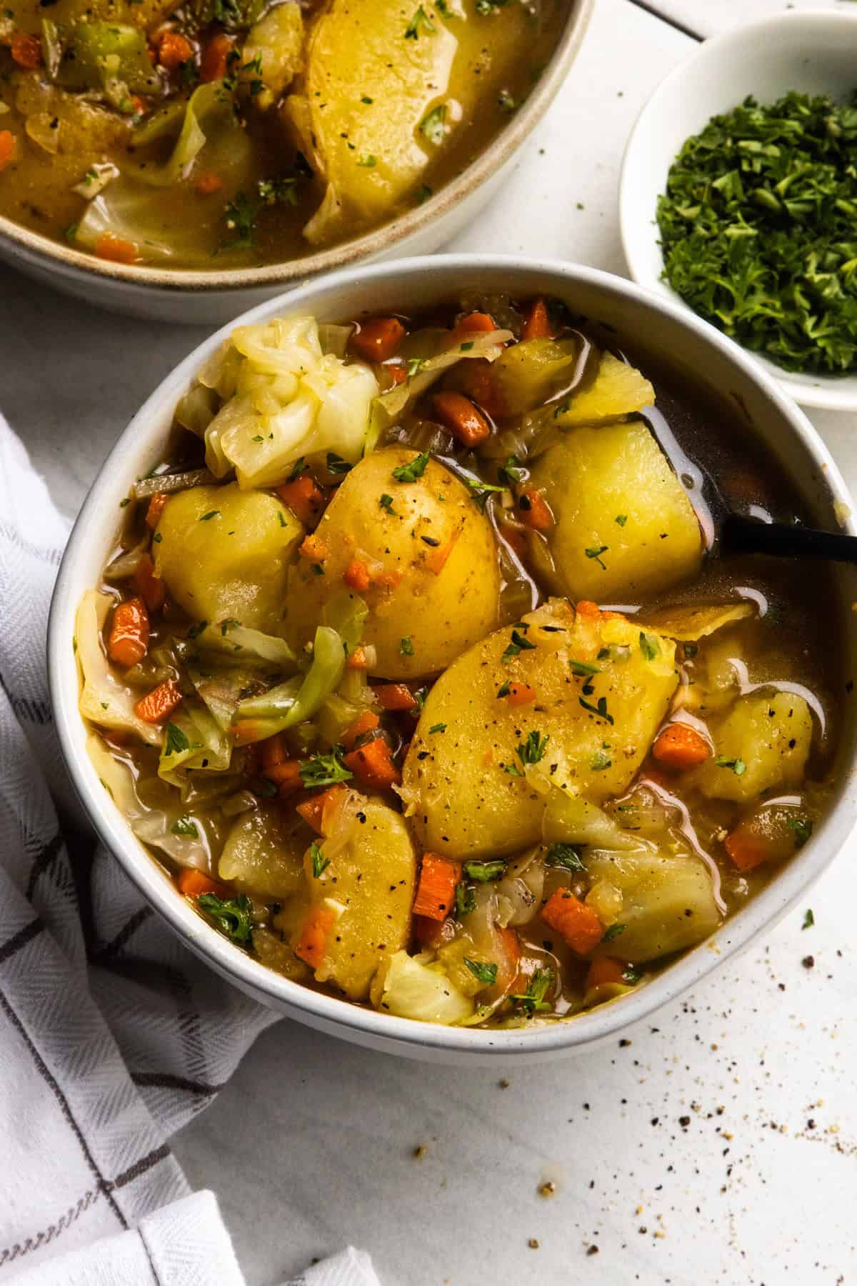 Vegan boiled dinner recipe in serving bowls.